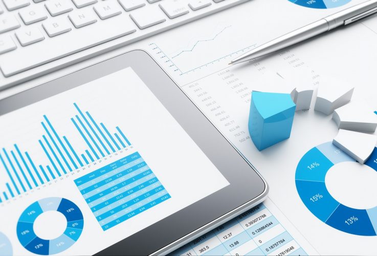 3D business report and laptop on desk